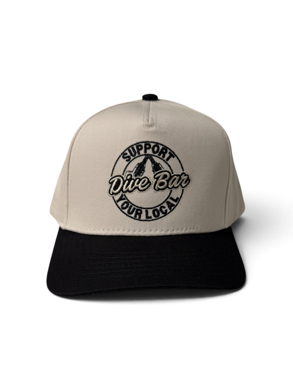 Back view of cream snapback cap embroidered with The Happiest
